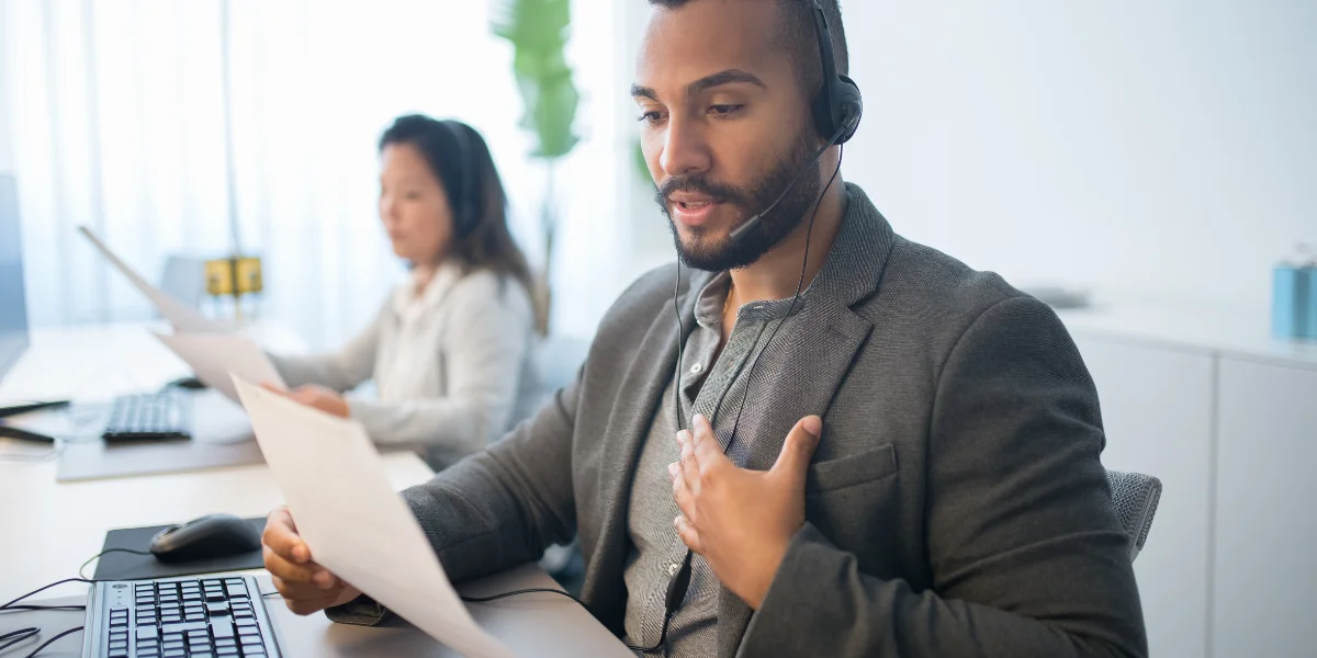 A man is handling calls to understand B2B Telesales Strategy