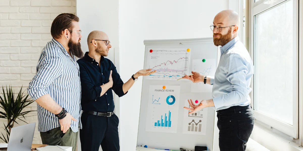 The employees are discussing how to Scale Customer Support with AI