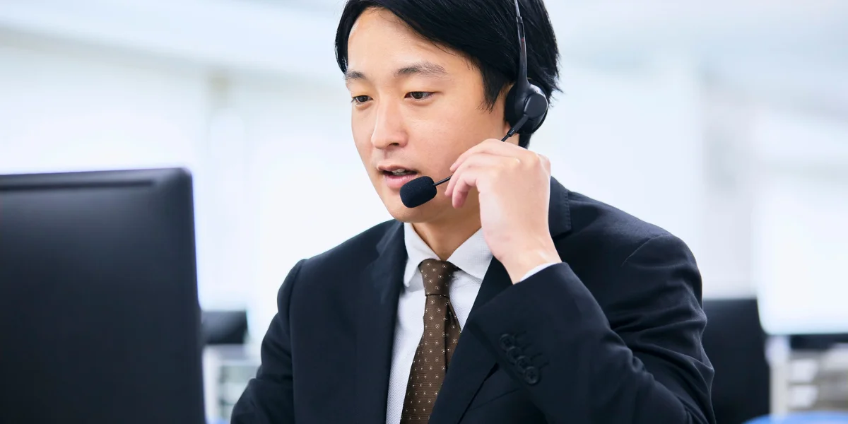 An employee is explaining call center outsourcing benefits to the customers in Noida