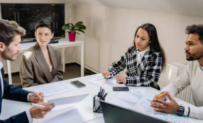 The employess are discussing When to Outsource B2B Sales